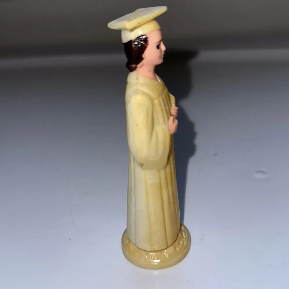 Vintage thin hard plastic‎ female graduate holding diploma cake topper